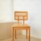 Steam-bent solid ash wood
